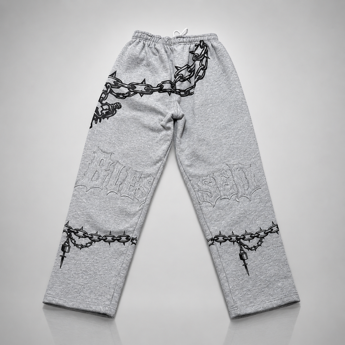 Gray sweatpants with black chain and lock designs on a light gray background