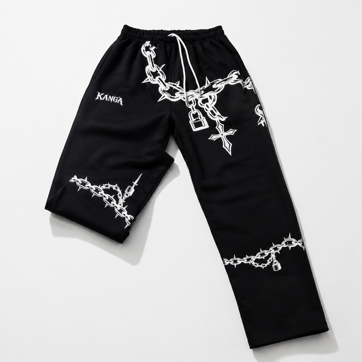 Black pants with white designs and 'KANGA' branding on a light gray background
